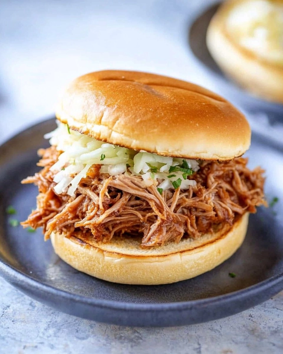 Slow Cooker Pulled Pork | Tender Shredded Pork Sandwiches